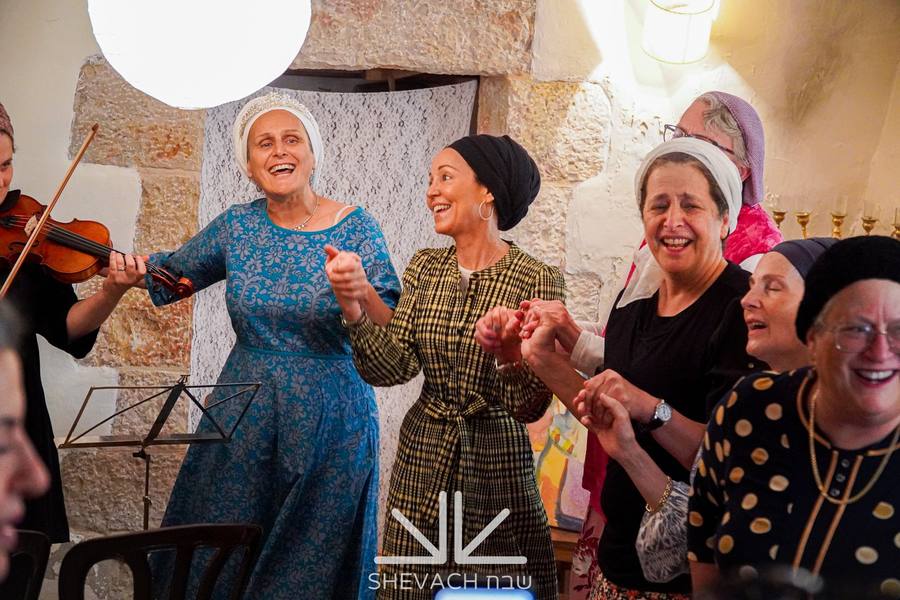Shevach women singing and dancing together